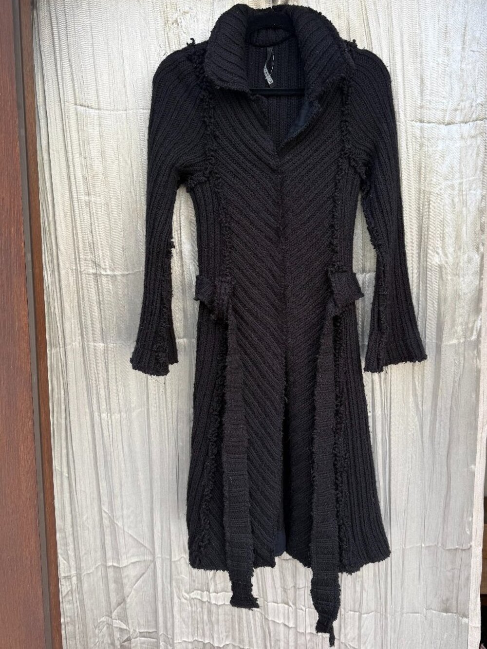 Poleci black sweater duster with raw edge seams